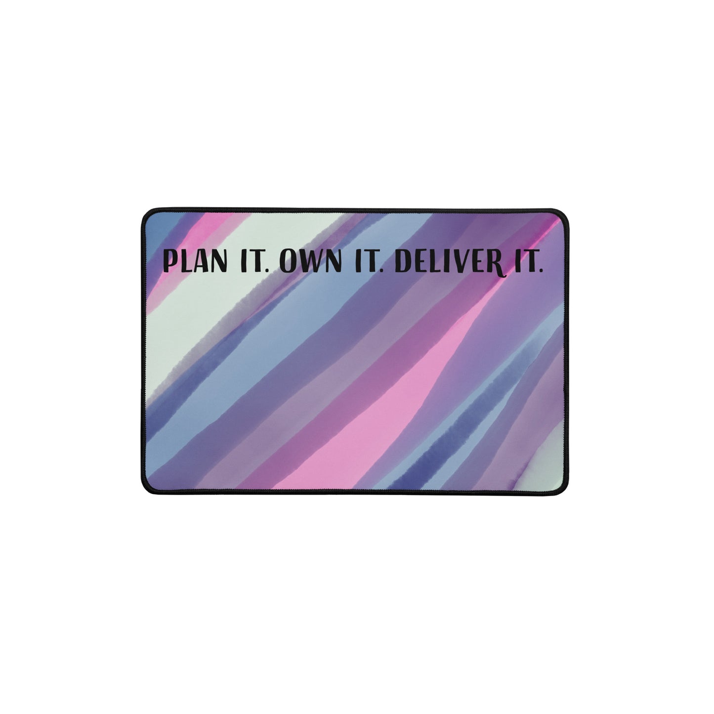 Colorful abstract desk mat with the quote 'Plan It. Own It. Deliver It.' in bold lettering, designed for women project consultants and entrepreneurs