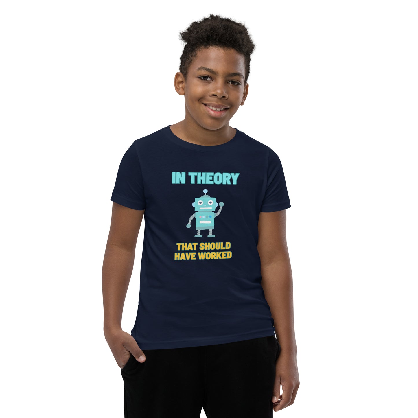 A boy wearing a shirt that says "In Theory That Should Have Worked"
