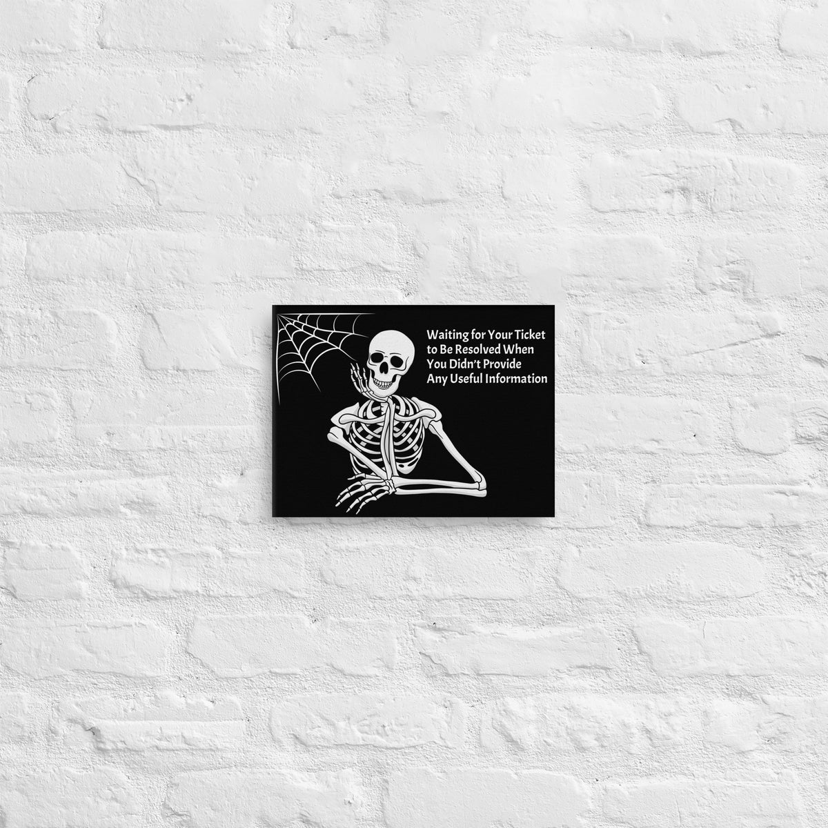 A Canvas Sign that says "Waiting for Your Ticket to be Resolved When You Didn't Provide Any Useful Information" and has a picture of a skeleton and a spider web.