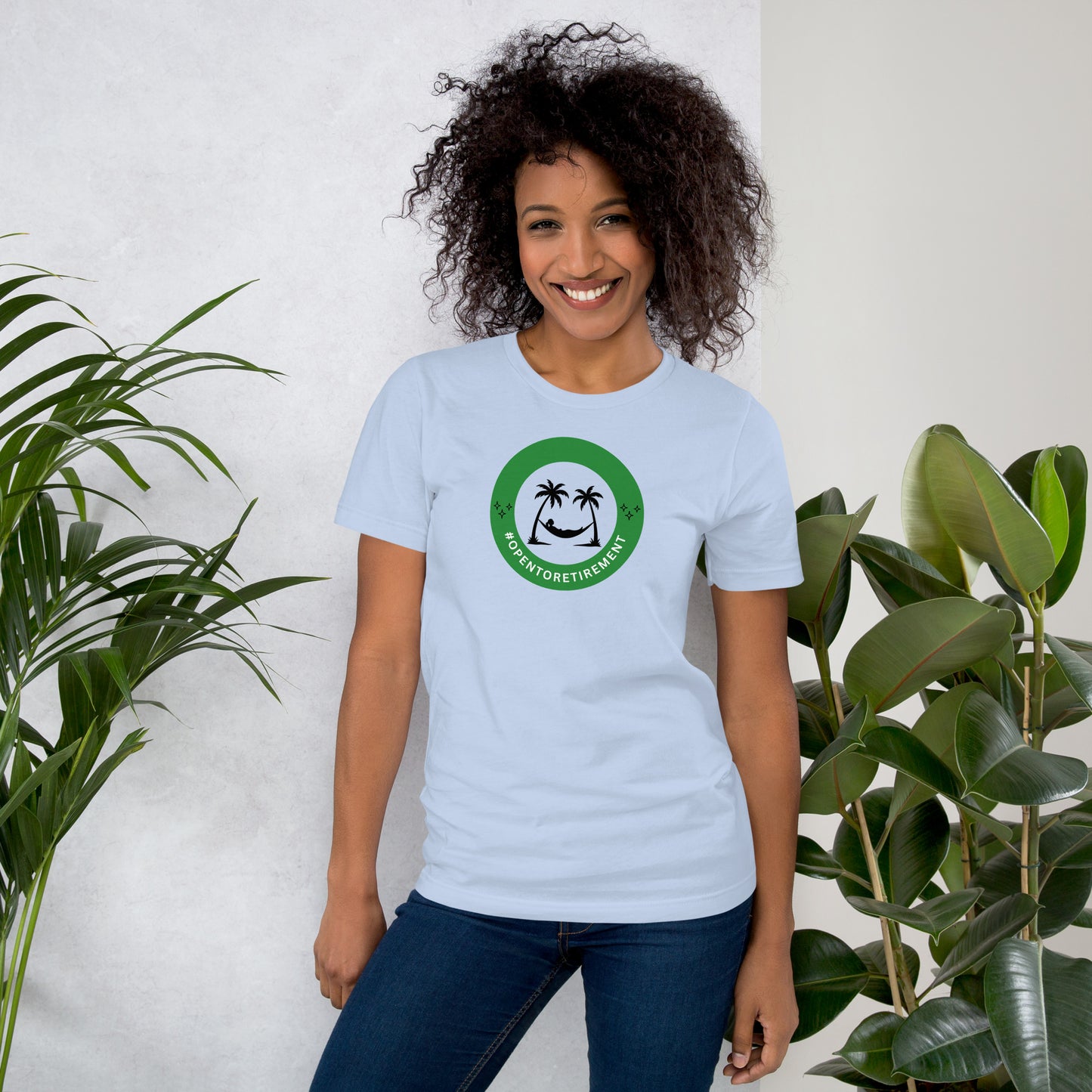 T-Shirt that has a design that shows a work status badge that says #OPENTORETIREMENT and shows a woman in a hammock between two palm trees.