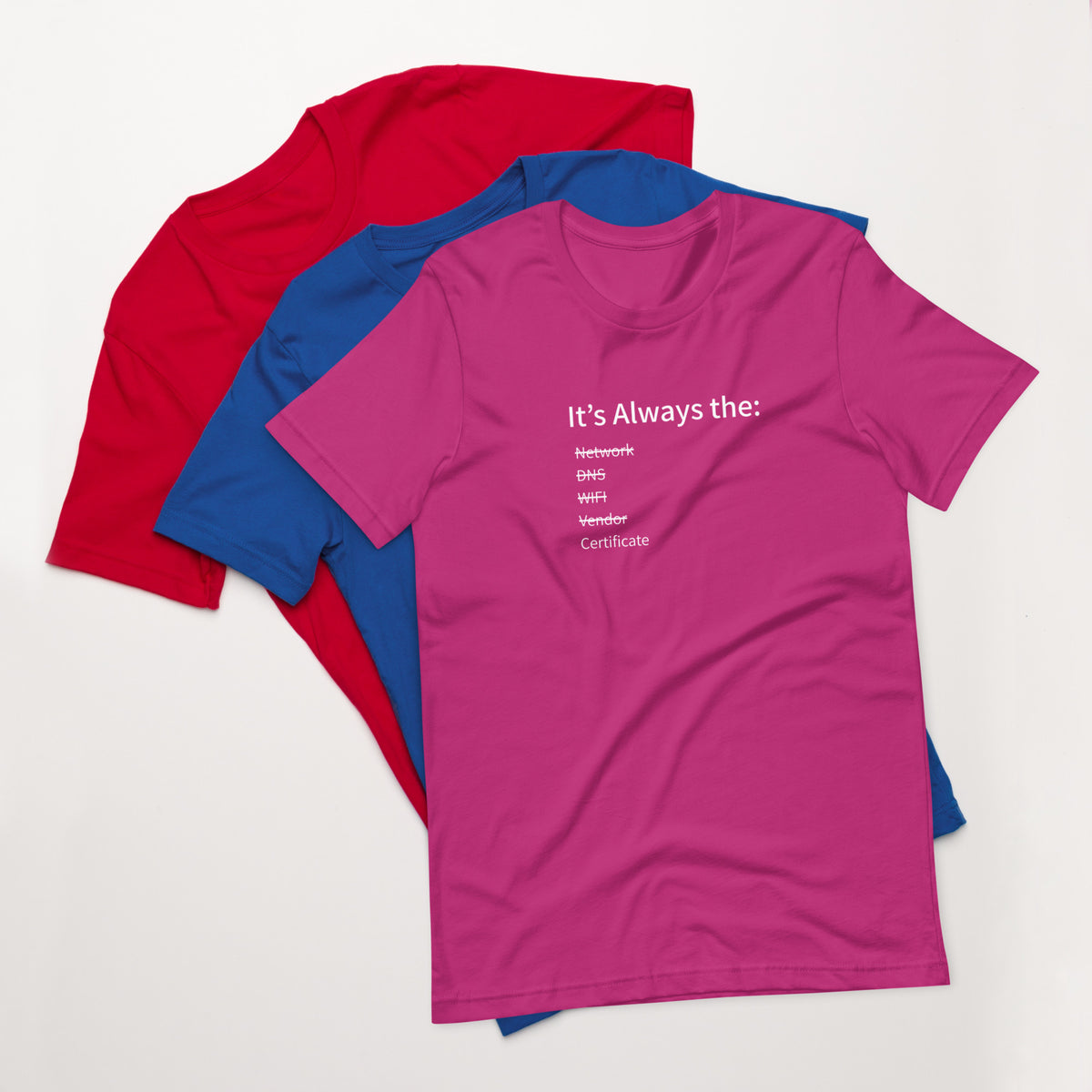 A stack of t-shirts in different colors that has a list of things that cause computer system outages that would be funny to an IT Professional.