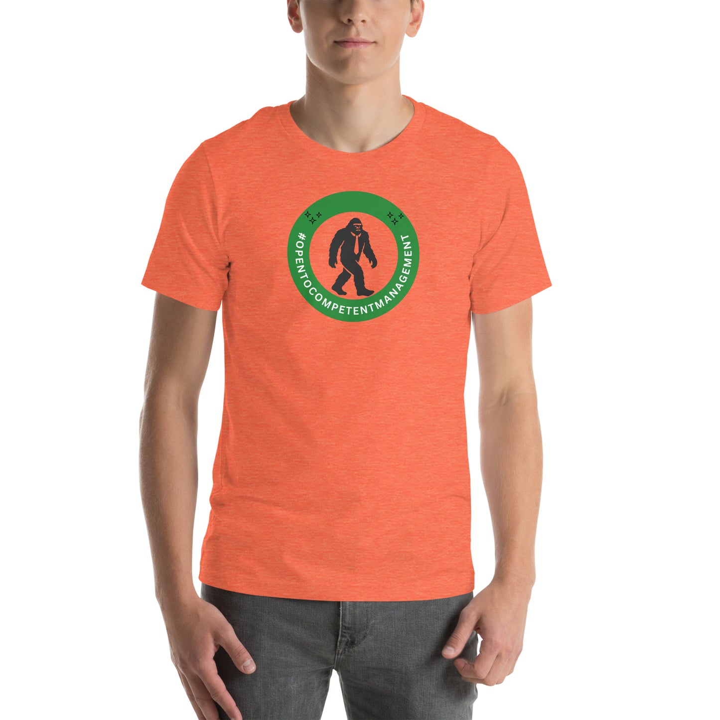 A t-shirt that shows a work status  badge that says #OpenToCompetentManagement with a picture of a bigfoot in a tie.