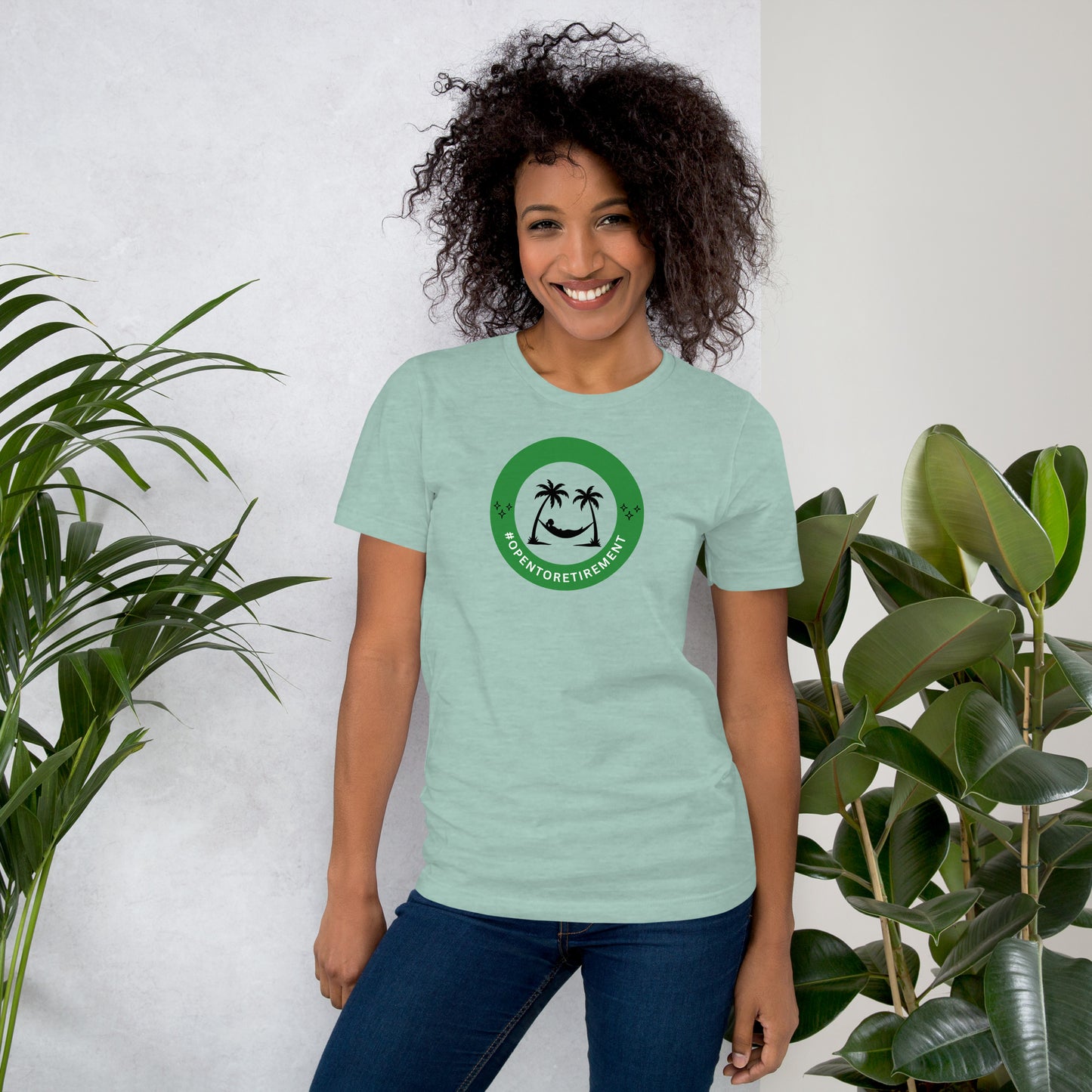 T-Shirt that has a design that shows a work status badge that says #OPENTORETIREMENT and shows a woman in a hammock between two palm trees.