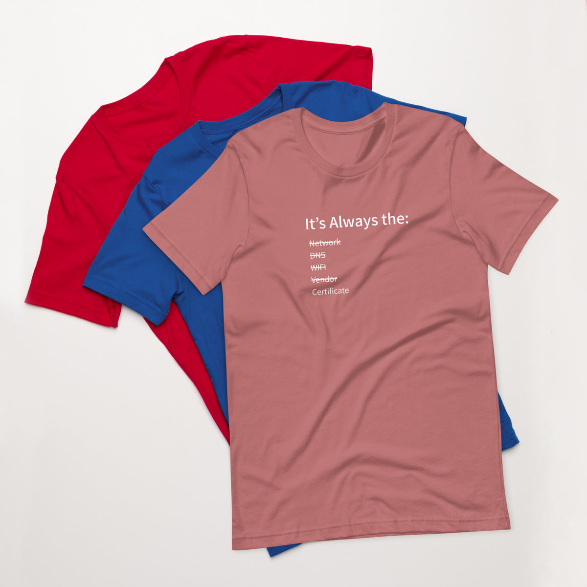 A stack of t-shirts in different colors that has a list of things that cause computer system outages that would be funny to an IT Professional.
