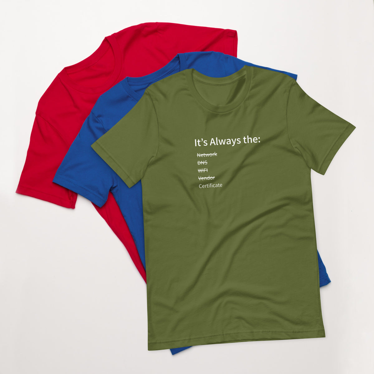 A stack of t-shirts in different colors that has a list of things that cause computer system outages that would be funny to an IT Professional.
