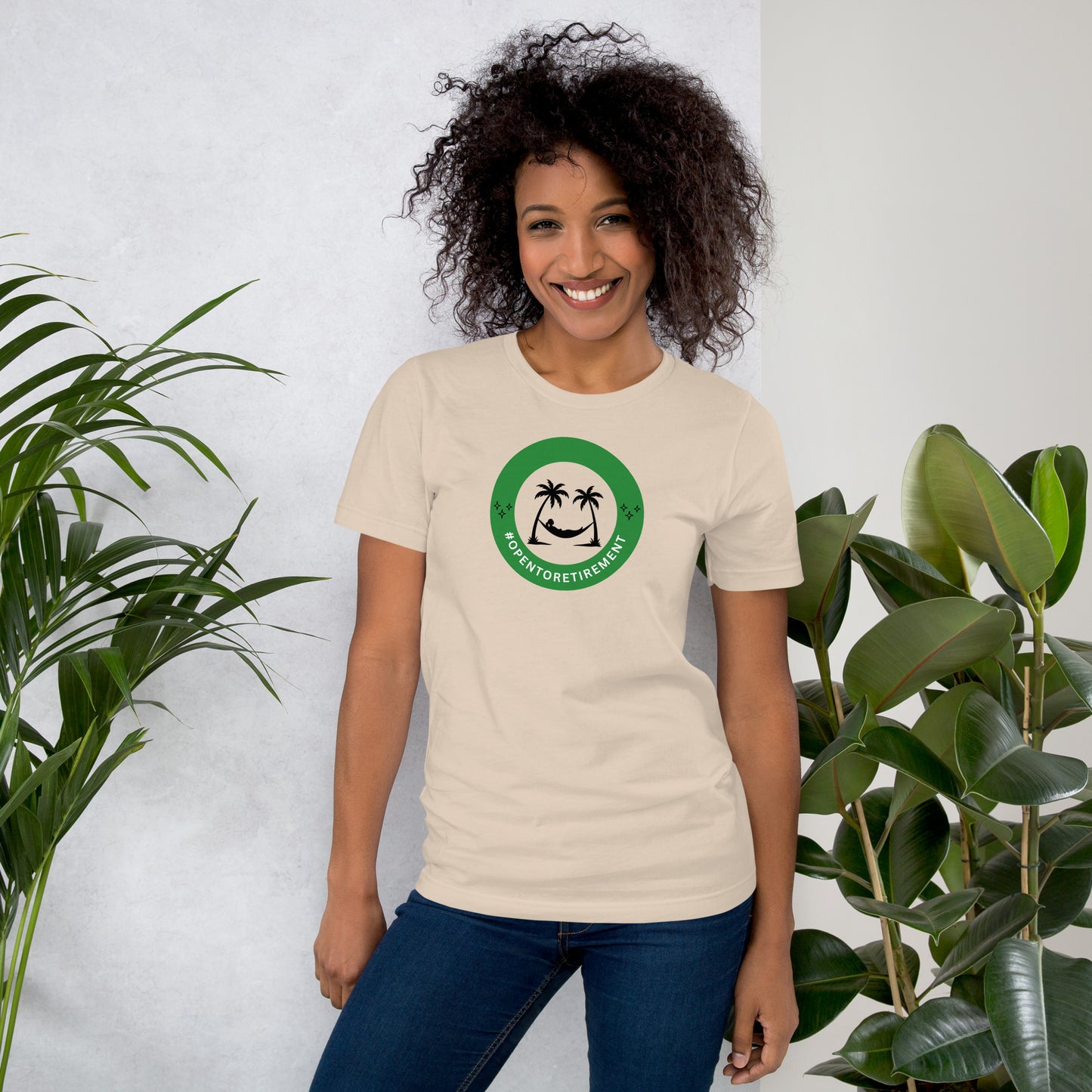 T-Shirt that has a design that shows a work status badge that says #OPENTORETIREMENT and shows a woman in a hammock between two palm trees.