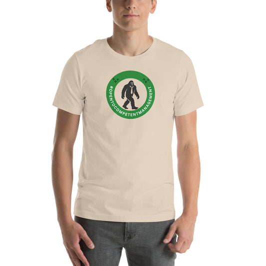 A t-shirt that shows a work status  badge that says #OpenToCompetentManagement with a picture of a bigfoot in a tie.