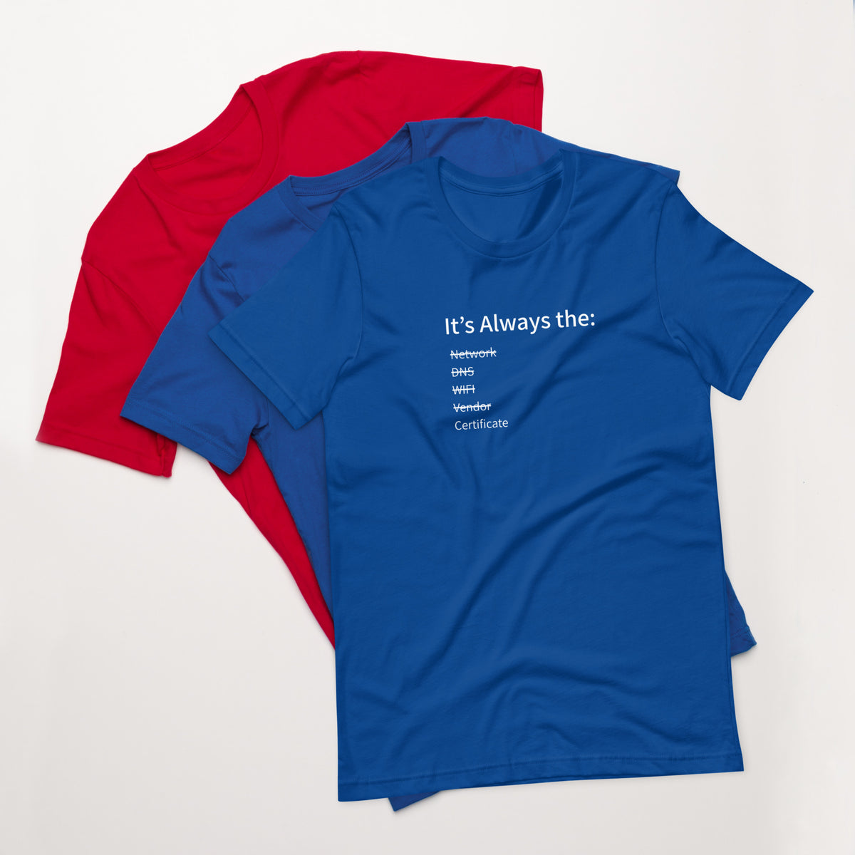 A stack of t-shirts in different colors that has a list of things that cause computer system outages that would be funny to an IT Professional.