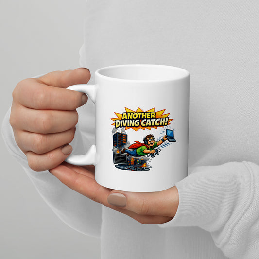 A White Glossy Mug that says Another Diving Catch! and has a picture of an IT person saving the day   that will make a great gift.